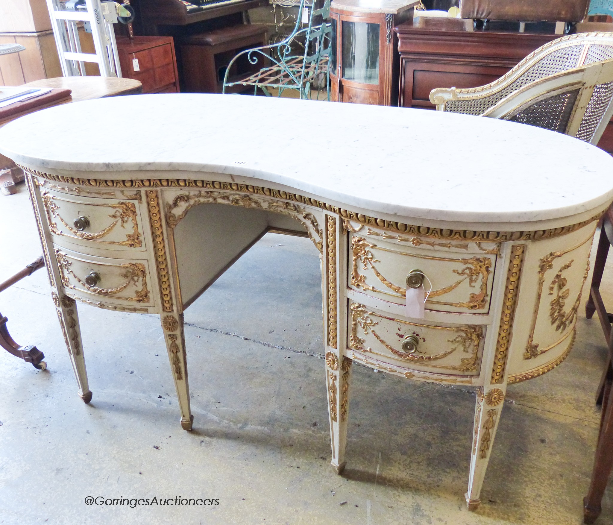 A Louis XVI style parcel giltwood and painted kidney shaped dressing table with marble top, width 146cm, depth 66cm, height 78cm